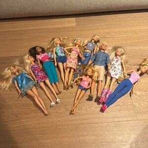 10 Used Barbie dolls